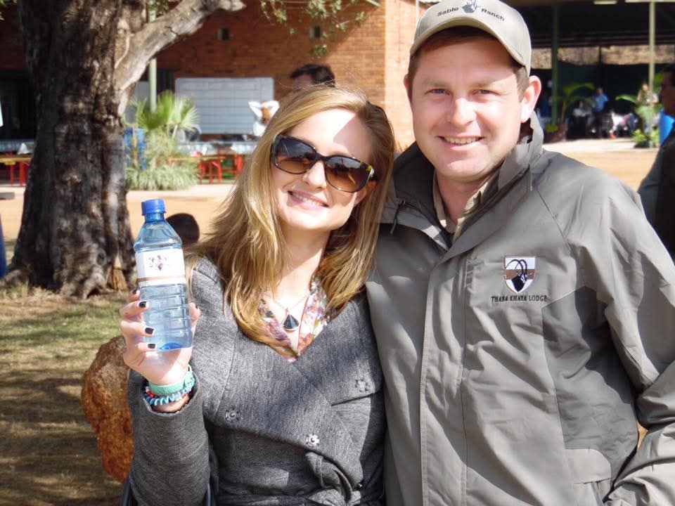 Angelo and a friend smiling together at an outdoor ranch gathering