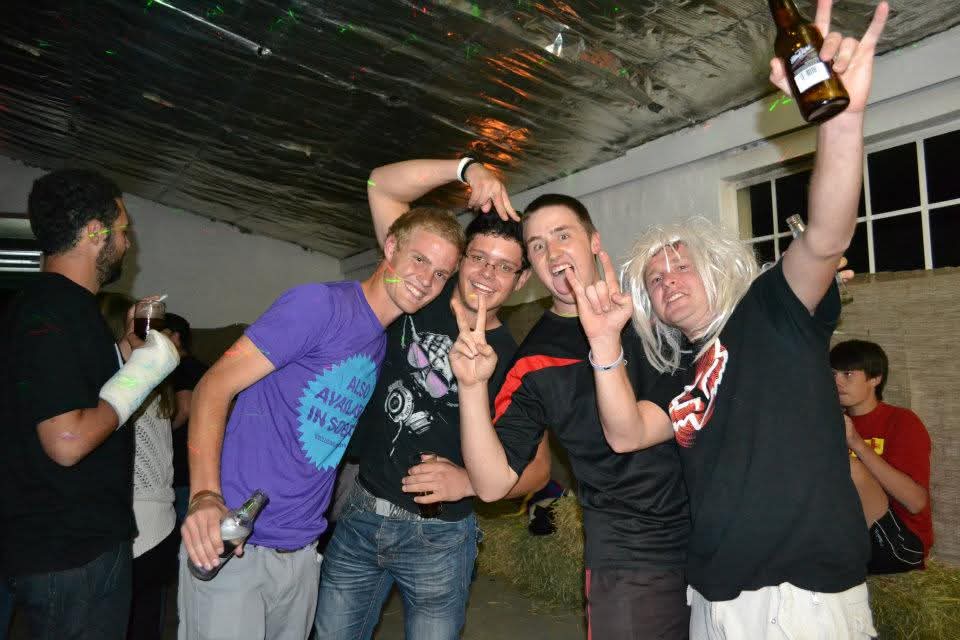 Angelo and friends celebrating at a fancy dress party