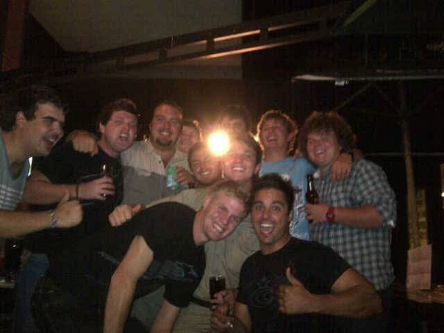A big group of friends celebrating together at night