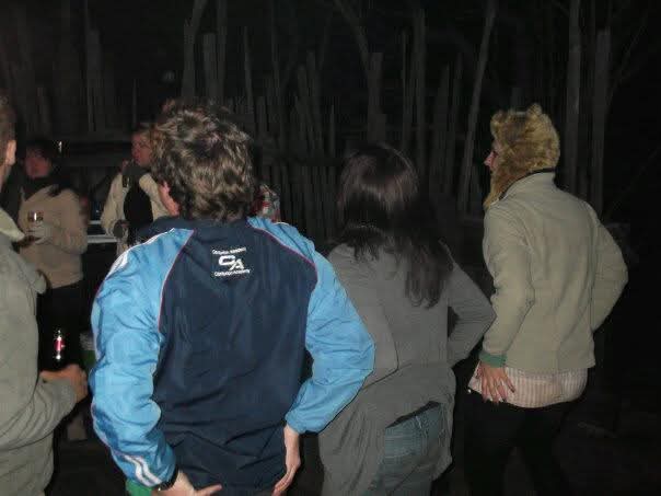 Angelo and friends dancing together at a night-time party