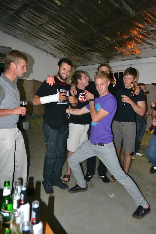 Friends dancing together under the laser lights at the party