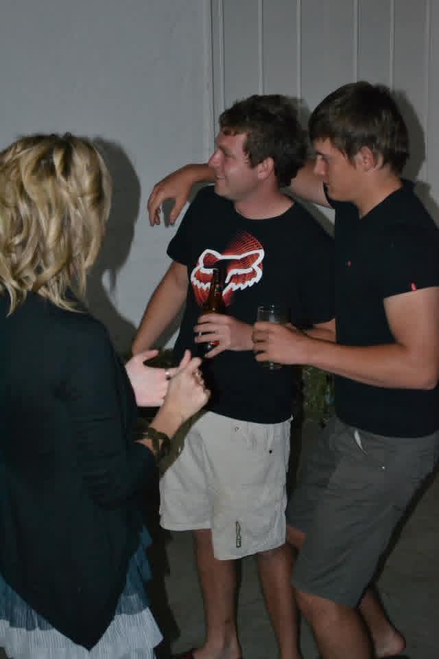 Angelo laughing with friends at his 21st birthday party
